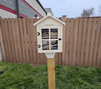Little free library located in front of a ymca. 